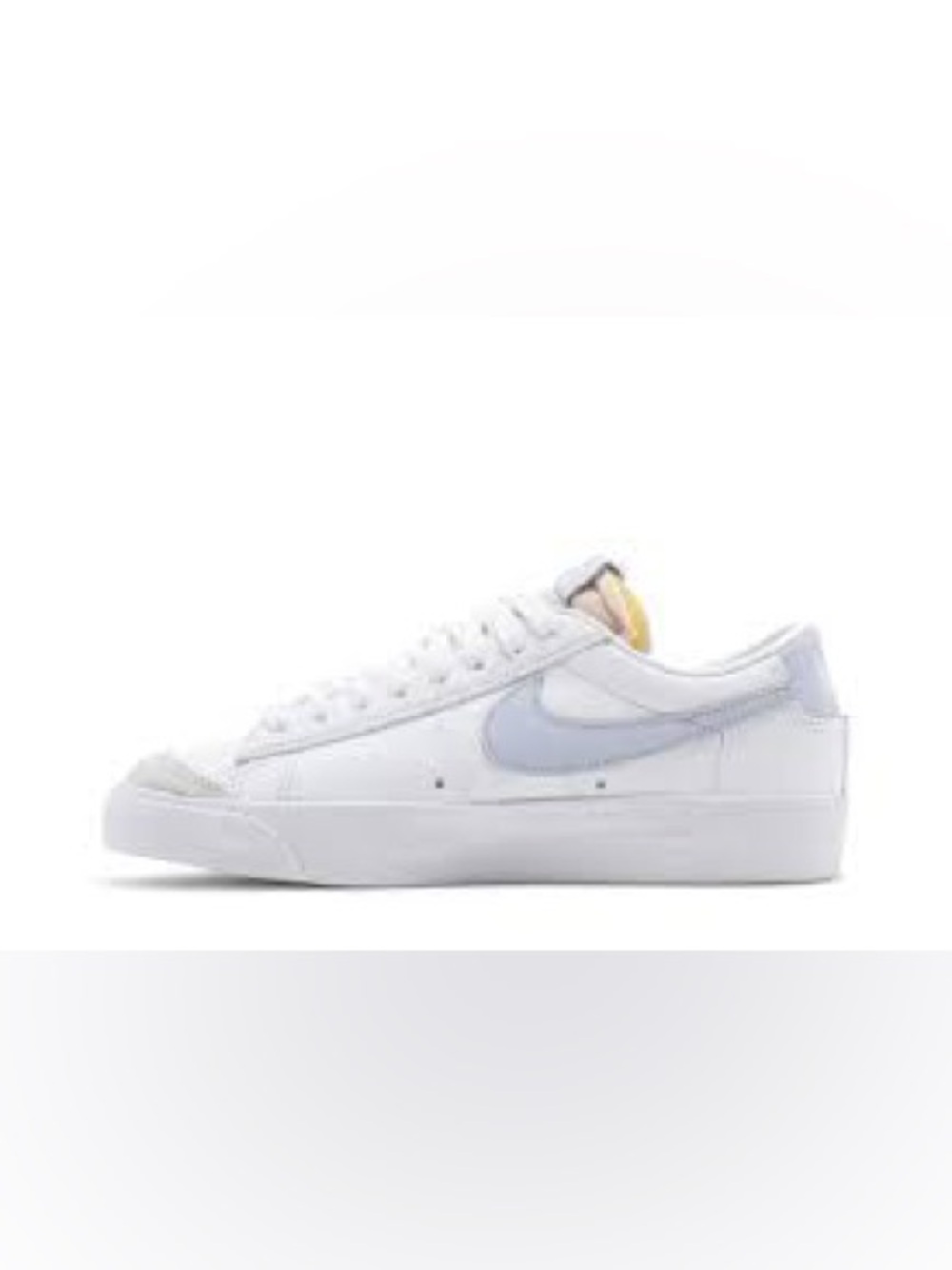 Nike White Leather Sneakers with Light Gray Swoosh and Yellow Tongue Accent